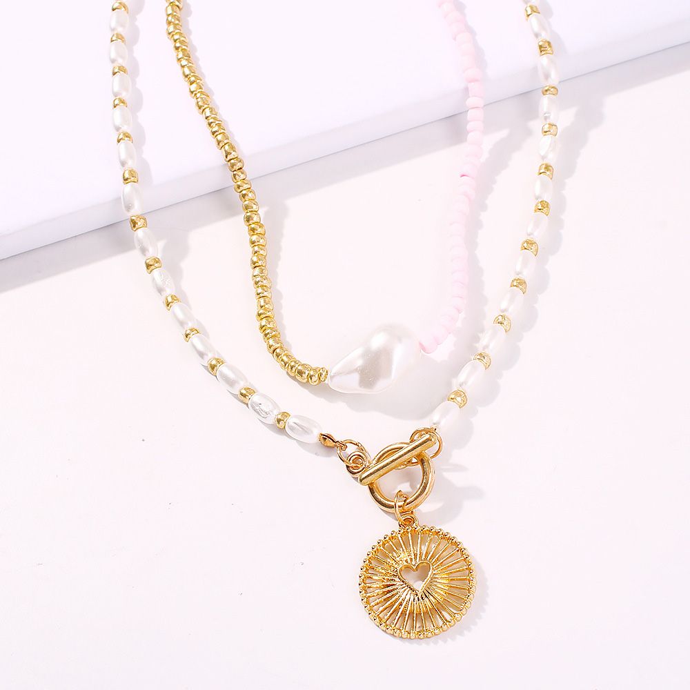 Pearl Patch Hollow Heart Pendant Necklace