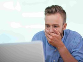 medical billing errors closeup shocked young man working laptop